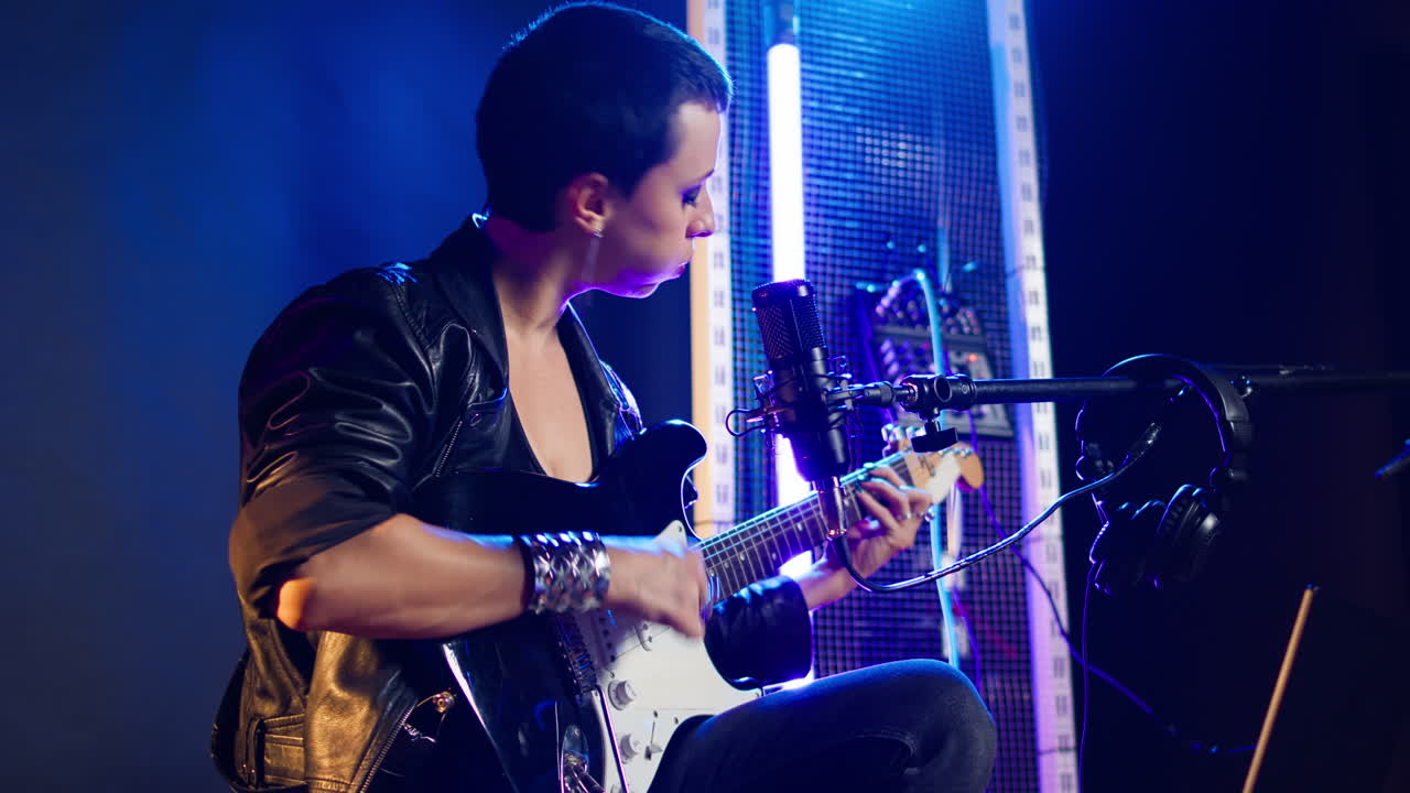 Musician performing on stage with electric guitar