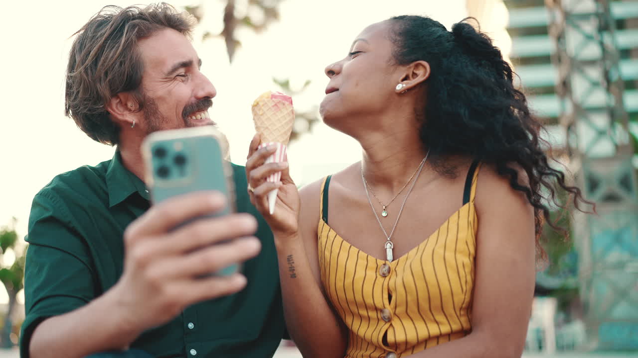 Couple taking selfie with ice cream