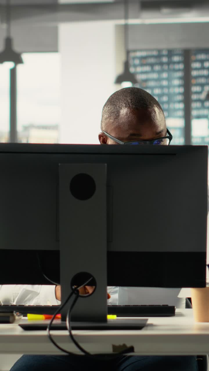 Vertical Video Diverse colleagues working in modern office and focusing on project planning