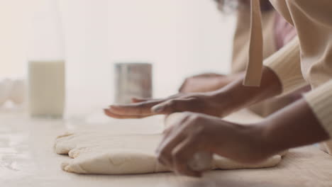 woman kneading dough