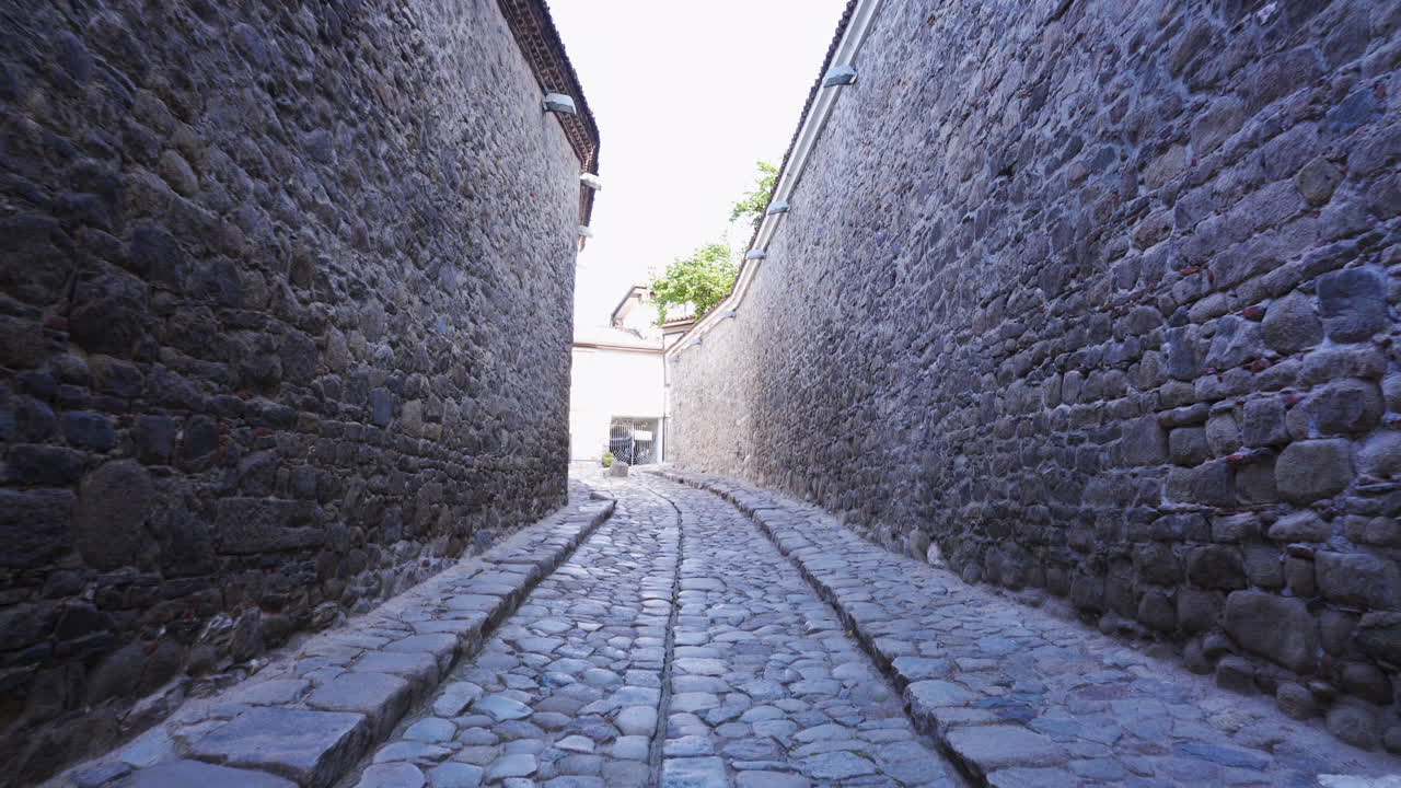 Historic Hisar Kapia Gate in Plovdiv’s Old Town, a medieval architectural landmark dating back to the 11th–13th century, revealed in a cinematic push in shot