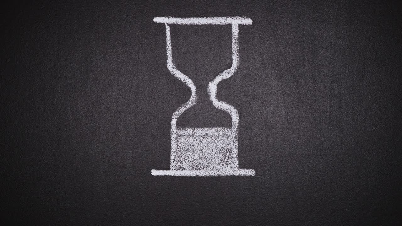 Cinemagraph of hourglass rotating on chalkboard and time flies phrase