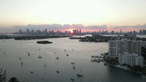 sunset biscayne bay aerial and downtown miami buildings in setting sun