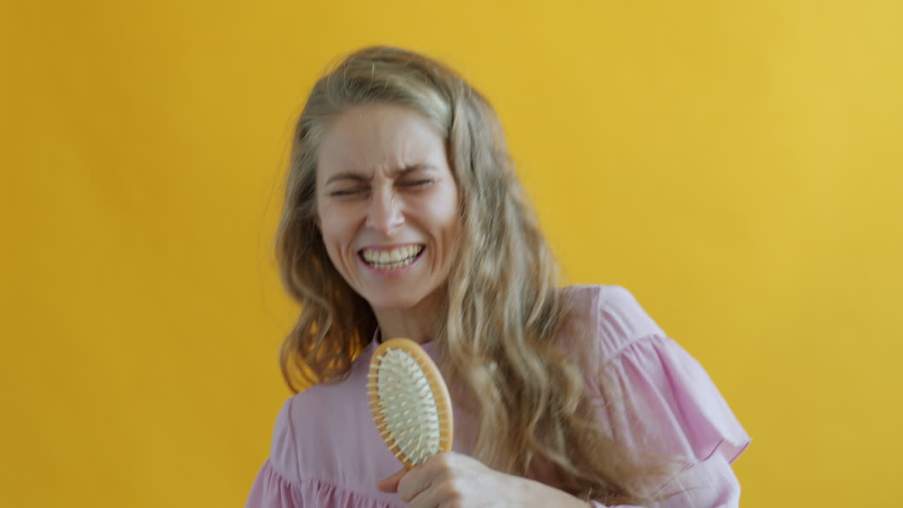 Woman Singing with Hairbrush