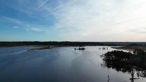 Kalmthoutse-heide-Panning-over-wetlands-revealing-the-split-of-Blue-to-white-skies