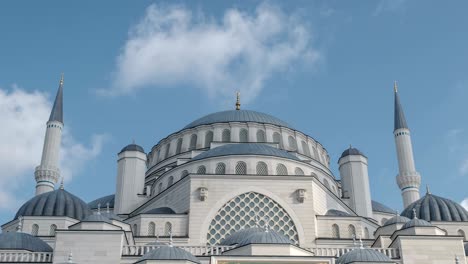 4k timelapse of islamic mosque. blue sky background with moving clouds.