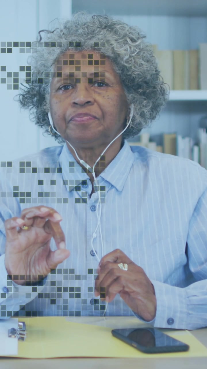 Animation of shapes over senior african american woman having video call