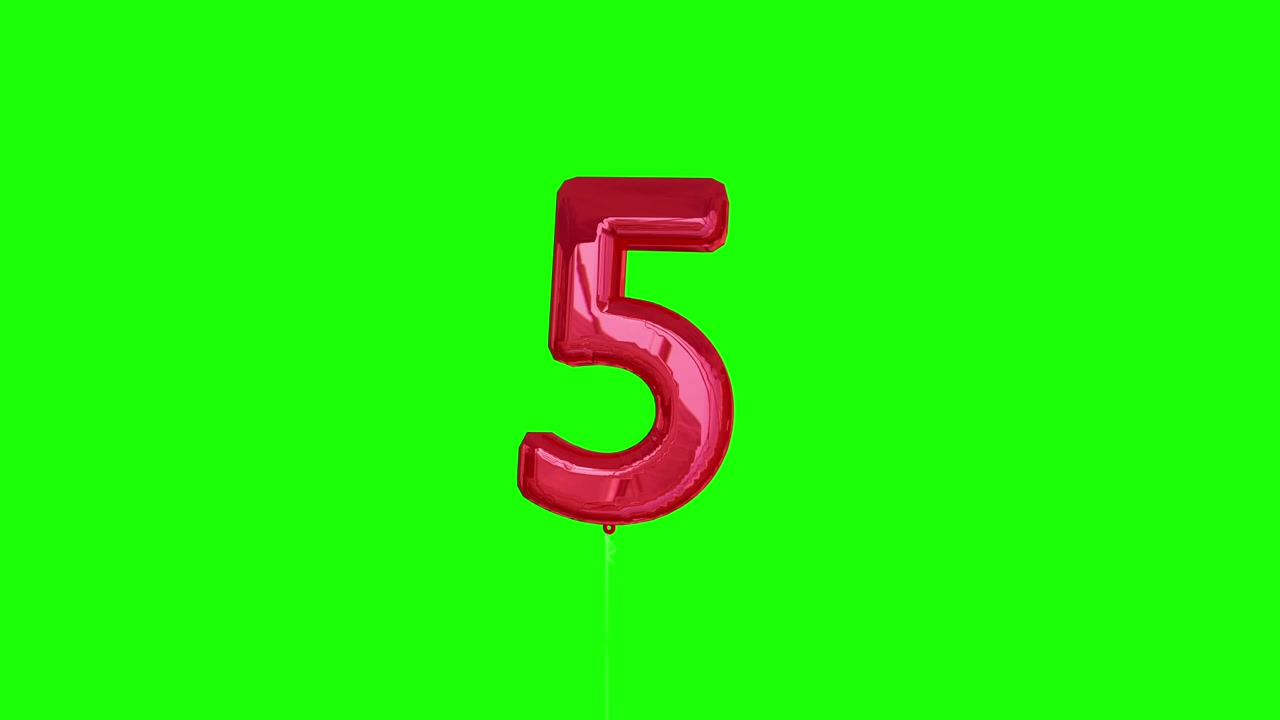 Red five balloon floating to the top against greenscreen