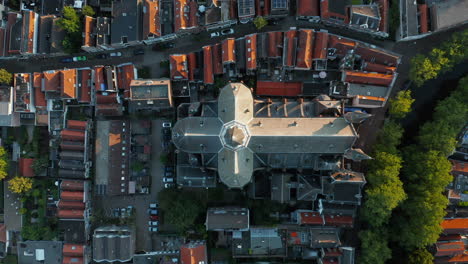 top view of gouwekerk church at the riverside of gouwe river in gouda, netherlands