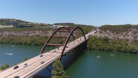 establishing drone shot of the pennybacker bridge over lake austin in austin, texas