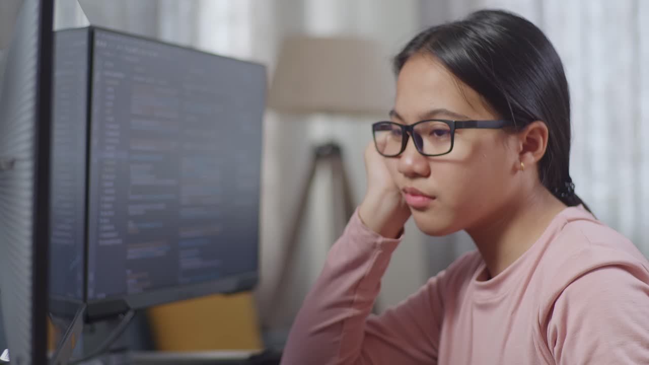 Teenager Concentrating on Coding