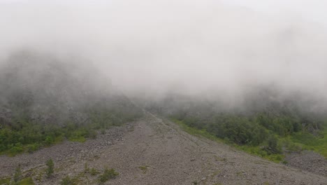 thick fog descends at top of the mountain