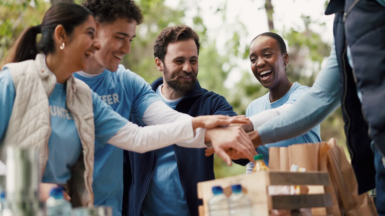 Happy Diverse Volunteers Celebrate Success with Team Huddle and Clapping