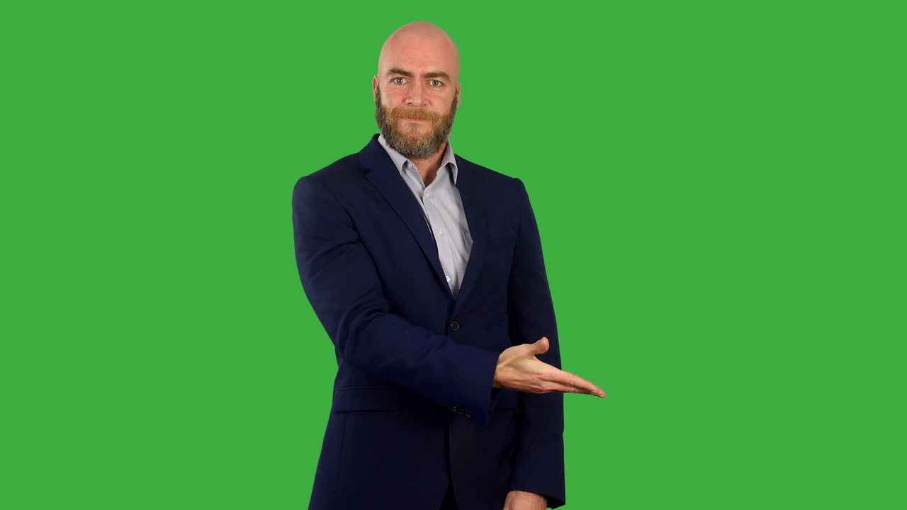 A businessman revealing a list or feature at the side of a screen using a swiping hand gesture on green screen