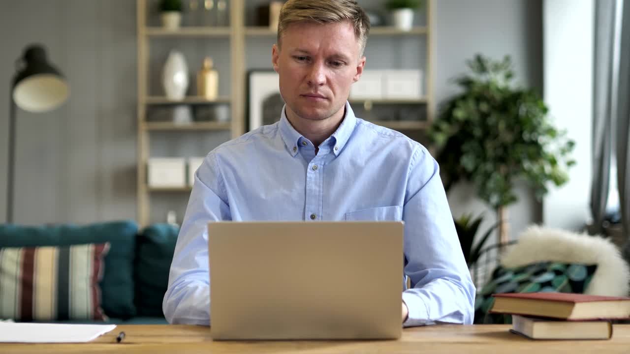 Pensive Businessman Thinking and Working on Laptop