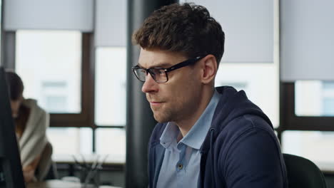 Stressed businessman analyzing computer report closeup. Nervous it manager look