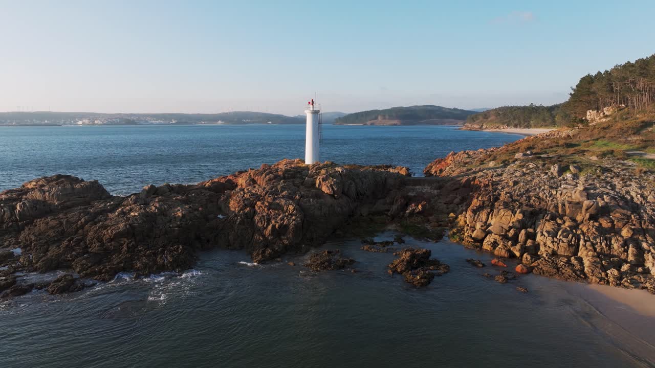 Waves Crashing In The Coastline Fazo baliza do Lago With Praia Da Barreira And Praia do Lago In Muxia, A Coruña, Spain. - aerial pullback shot