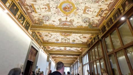 tourists exploring the uffizi gallery's ornate hallways