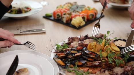 group enjoying a delicious seafood platter with sushi