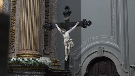 crucifix statue in ornate sanctuary of sameiro interior