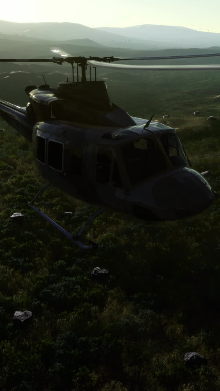 Helicopter flies over rugged terrain at sunset in a dramatic landscape