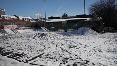 snow covered empty skate park, sheffield