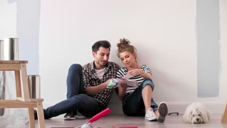 couple looking at paint swatches