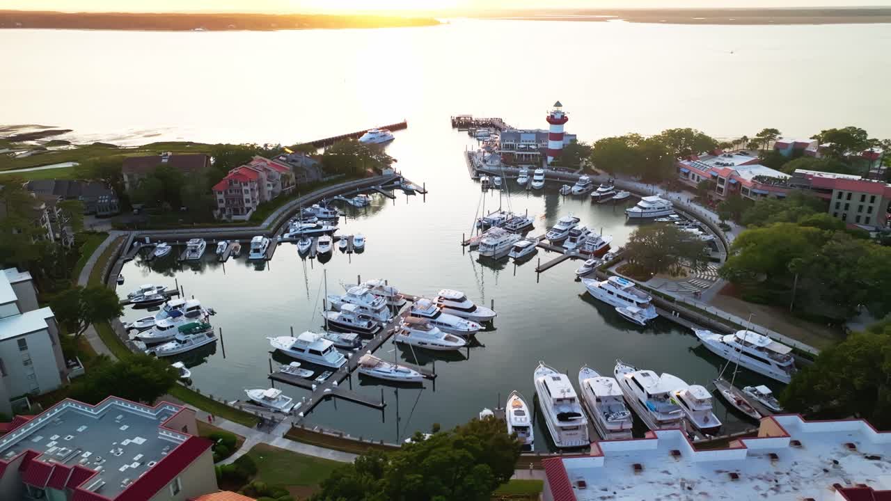 Harbour Town Pier South Carolina USA, Fading daylight at harbor, golden hues dancing on ocean surface