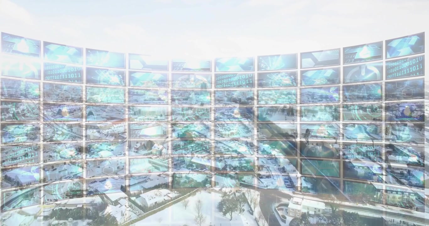 Curved wall of digital screens displaying cityscape and binary code animation