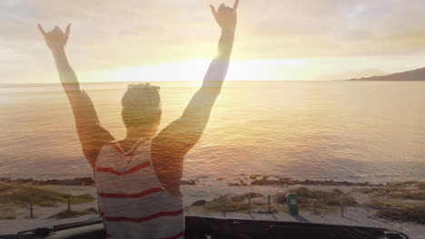 animation of caucasian woman with arms outstretched on beach