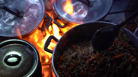 closeup of the food cooking in the pan own top of the acatenango vulcano in antigua, guatemala