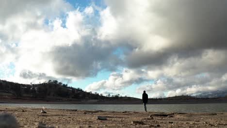 Black-Man-Walking-along-river-bank