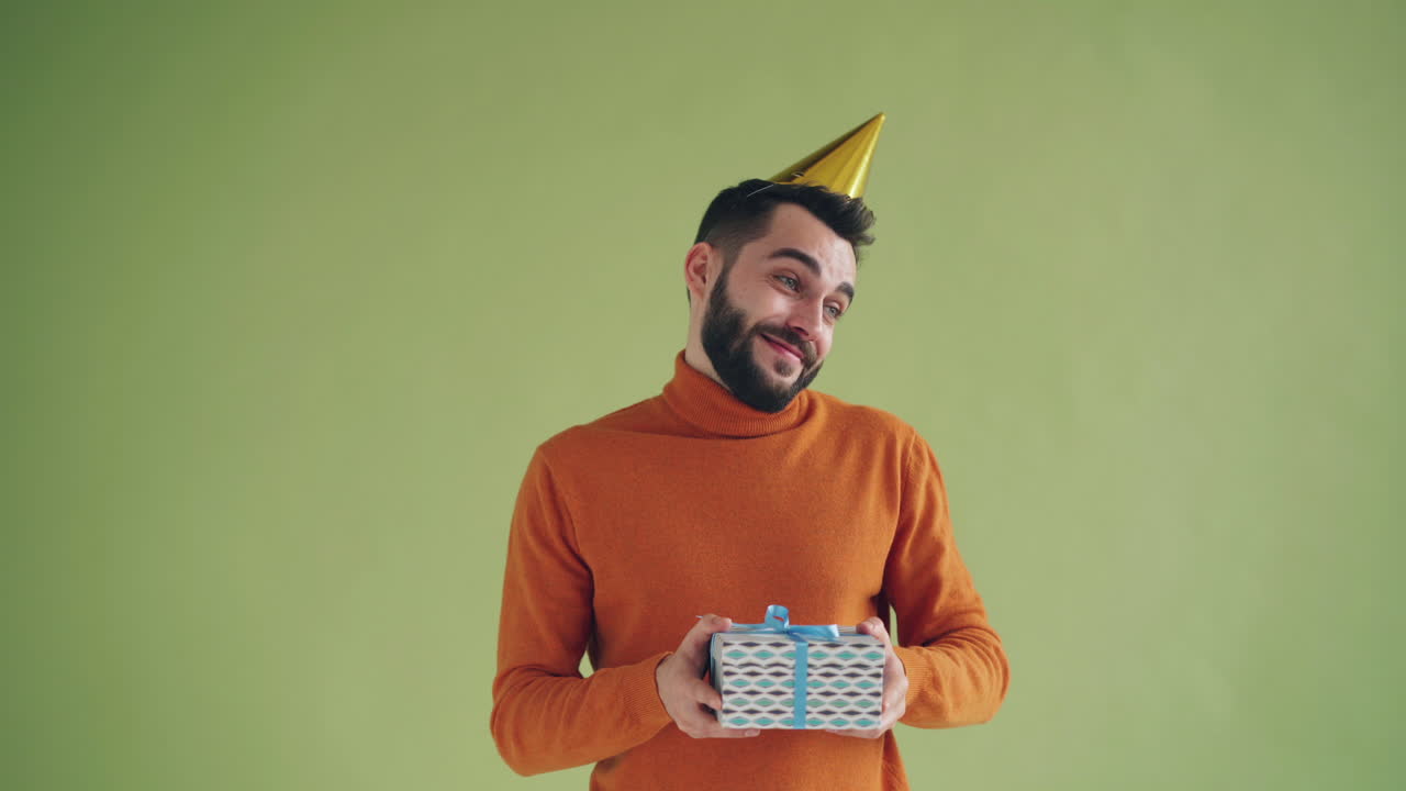 Man with a gift and party hat