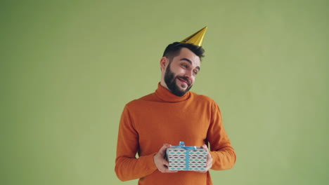 man with a gift and party hat