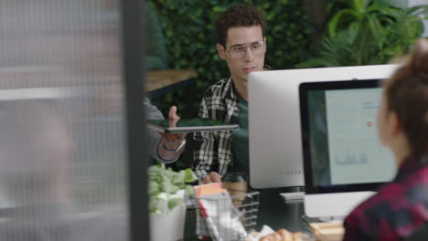 young multi ethnic business people working in busy modern office using digital tablet computer sharing information colleagues collaborating successful teamwork