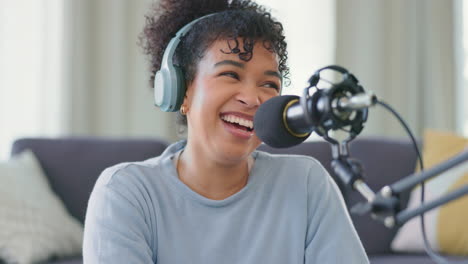 Cheerful-woman-recording-a-podcast-while-wearing