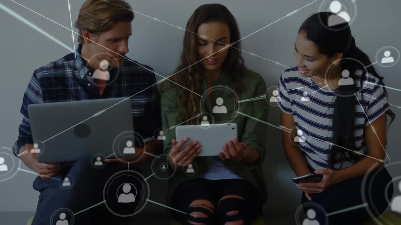 Network of connection icons against office colleagues using electronic devices