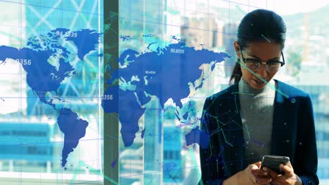 network of connections over world map against businesswoman using smartphone at office
