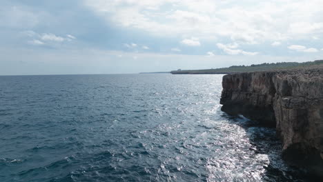 Drone-flight-over-the-mediterran-sea-at-the-spectacular-cliffs-at-Cala-Varques-on-Mallorca-island