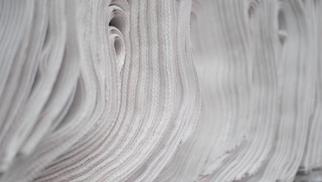 close-up of a stack of rolled up white paper