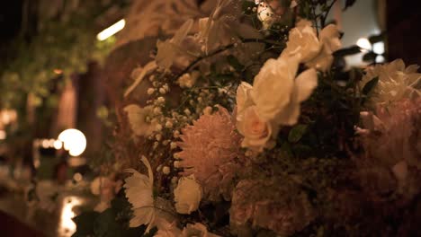 close up view of bouquet of flowers indoors at night