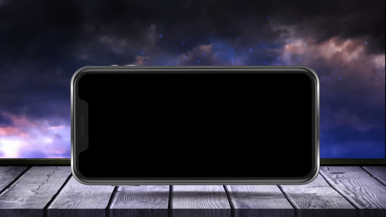 animación de pantalla de teléfono inteligente negro en superficie de madera con fuegos artificiales explotando en el fondo