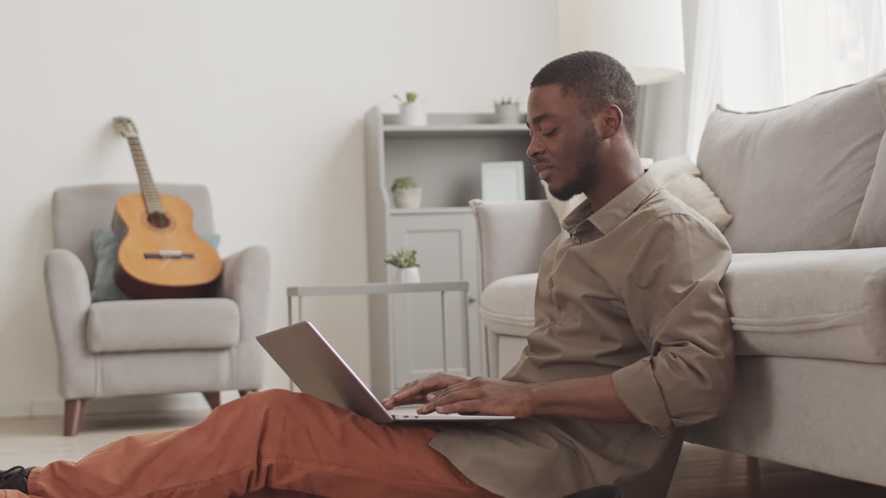 Male African Graduate Having Online Graduation Ceremony