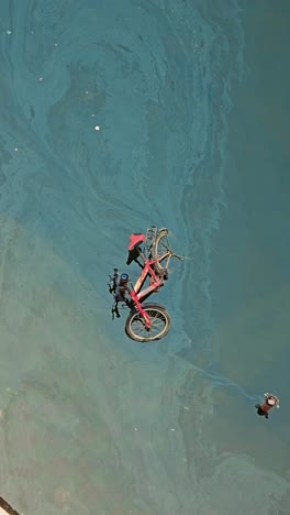 a bicycle submerged in floodwaters after the heavy rains