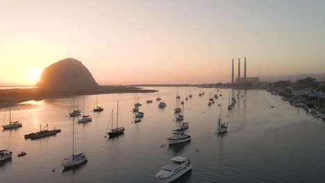 sunset at morro bay california while flying over the harbor near the powerplant