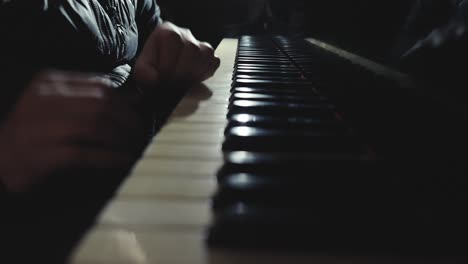 crazy mad hand and fingers moving on piano keyboard, playing music or pretending to play