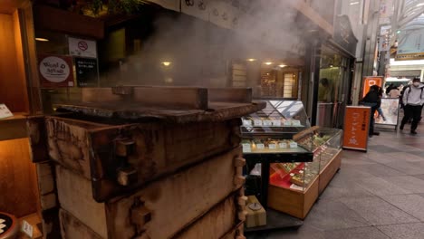 steam rising from a busy outdoor food stall