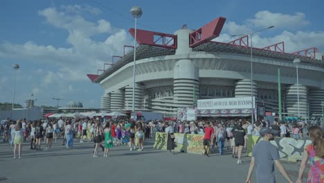 fans gather outside a stadium for taylor swift's the eras tour concert