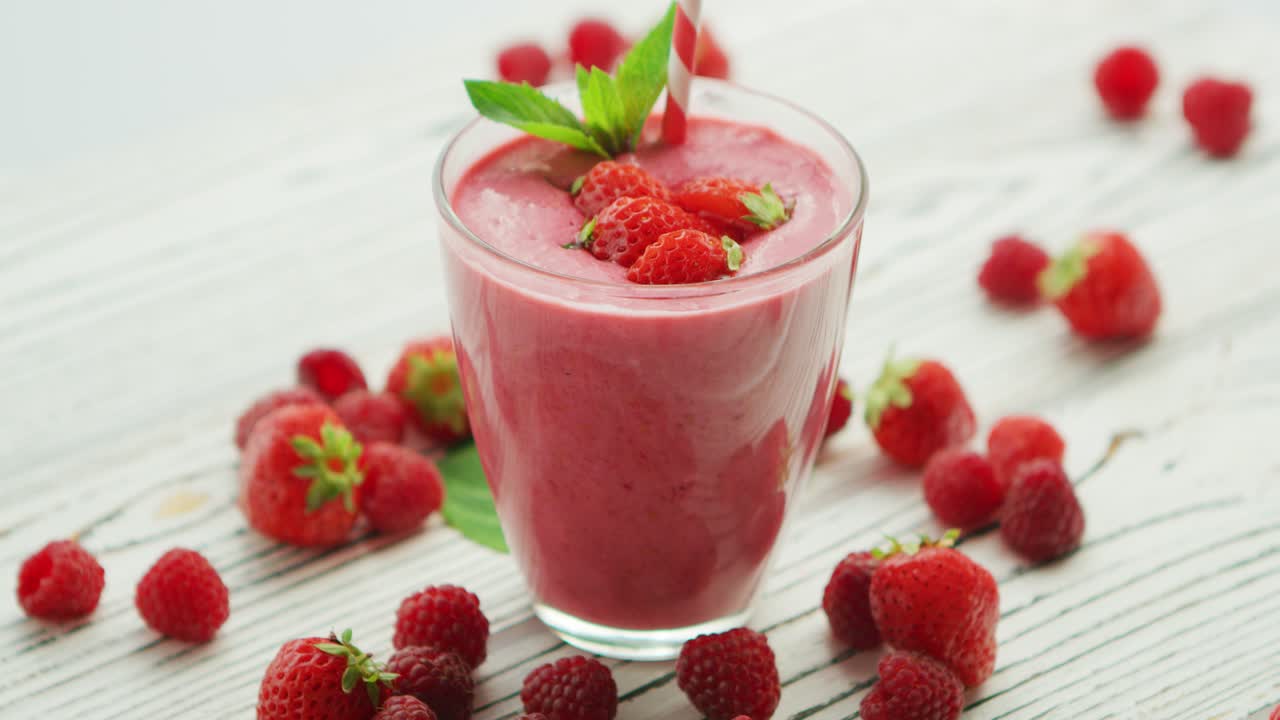 Strawberry smoothie in glass with mint