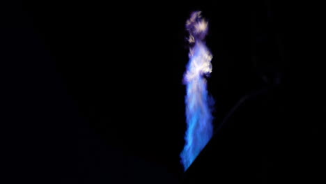 burner flames under parachute of hot air balloon at night, close up